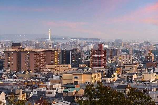Kyoto, Japan modern downtown city skyline at dusk with the tower in the distance