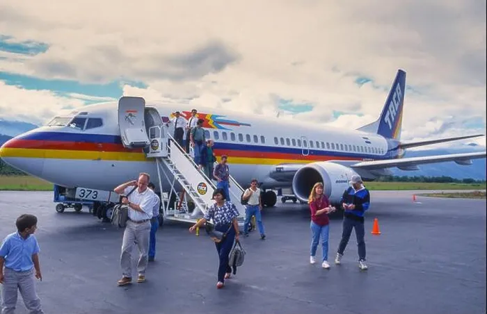 Framed Print : LA CEIBA AIRPORT, HONDURAS, DECEMBER 1995 - Passengers getting off TACA commercial jet at airport Framed Print : LA CEIBA AIRPORT, HONDURAS, DECEMBER 1995 - Passengers getting off TACA commercial jet at airport