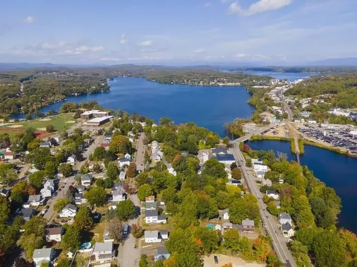 Framed Print : Laconia city center and Opechee Bay of Lake Winnipesaukee aerial view with fall foliage in downtown Laconia Framed Print : Laconia city center and Opechee Bay of Lake Winnipesaukee aerial view with fall foliage in downtown Laconia