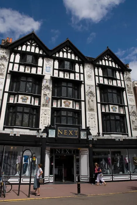 Framed Print : Next ladies clothes shop in a timber framed building Kingston Upon Thames Surrey UK Framed Print : Next ladies clothes shop in a timber framed building Kingston Upon Thames Surrey UK