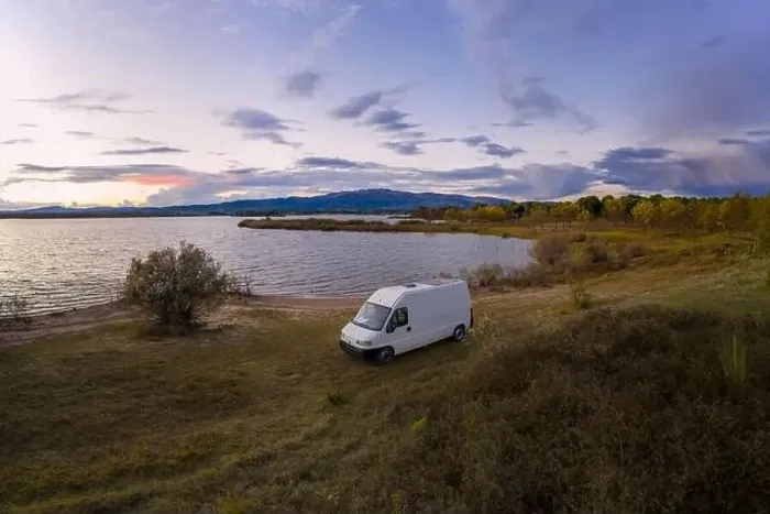Framed Print : Lake drone aerial view of a camper van with solar panel living van life mountain panorama landscape at sunset in Framed Print : Lake drone aerial view of a camper van with solar panel living van life mountain panorama landscape at sunset in