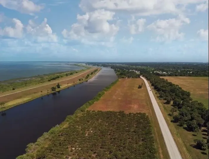 Framed Print : Lake Okeechobee scenic trail, canal and country road. Aerial view Framed Print : Lake Okeechobee scenic trail, canal and country road. Aerial view
