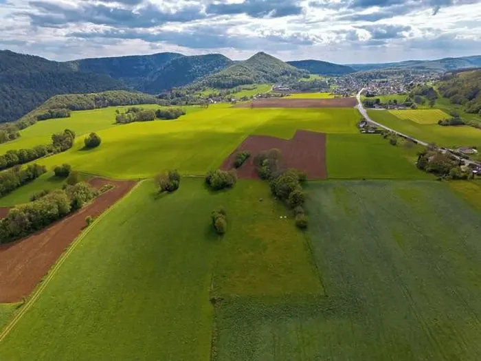 Framed Print : Landscape with fields, mountains and river in France near Besancon in spring, Franche-Comte Framed Print : Landscape with fields, mountains and river in France near Besancon in spring, Franche-Comte
