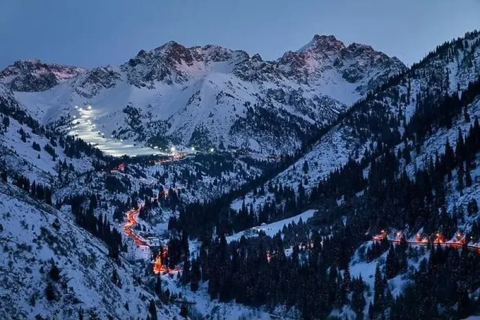 Framed Print : Landscape of glowing road from Medeu ice skate to Shymbulak ski resort at Tian Shan mountains at evening time in Almaty Framed Print : Landscape of glowing road from Medeu ice skate to Shymbulak ski resort at Tian Shan mountains at evening time in Almaty