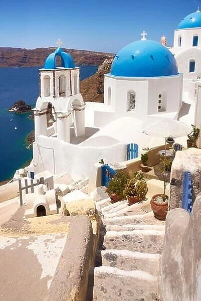 Landscape with greek white church overlooking the sea, Oia Town, Santorini Island, Greece