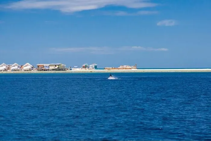 Framed Print : Landscape in Maldives Islands and over water villas and bungalows with group of dolphins swimming Framed Print : Landscape in Maldives Islands and over water villas and bungalows with group of dolphins swimming