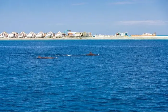 Framed Print : Landscape in Maldives Islands and over water villas and bungalows with group of dolphins swimming Framed Print : Landscape in Maldives Islands and over water villas and bungalows with group of dolphins swimming