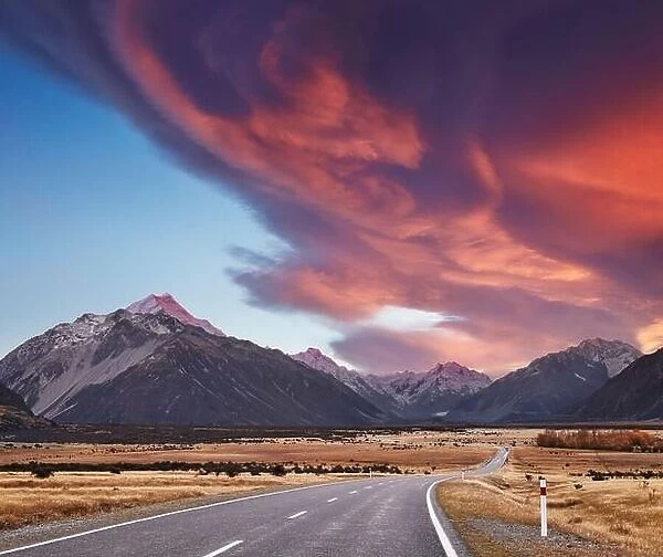 Landscape with road and snowy mountains at sunrise, Southern Alps, New Zealand