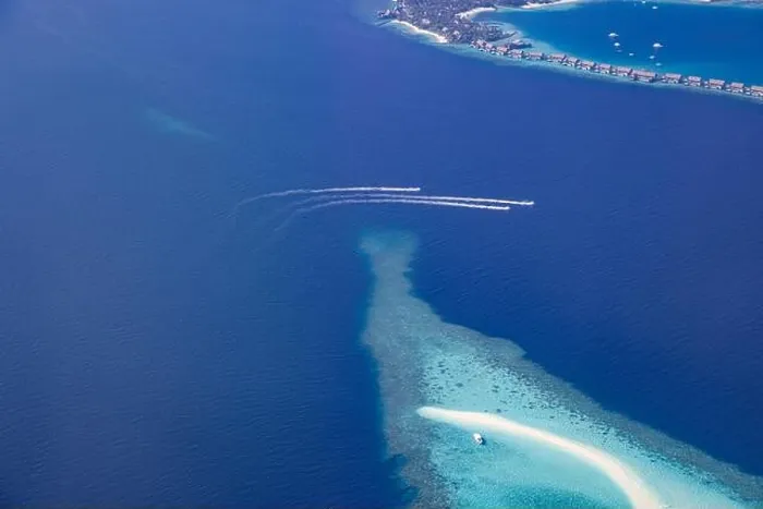 Framed Print : Landscape seascape aerial view over Maldives luxury resort villas with atoll sandbank island. Jet skis having fun in ocean lagoon. Luxurious summer Framed Print : Landscape seascape aerial view over Maldives luxury resort villas with atoll sandbank island. Jet skis having fun in ocean lagoon. Luxurious summer