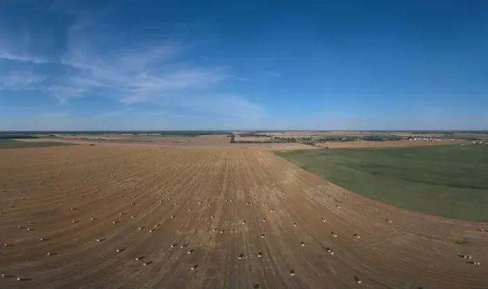 Framed Print : Landscape view from drone, yellow and green fields and haystacks