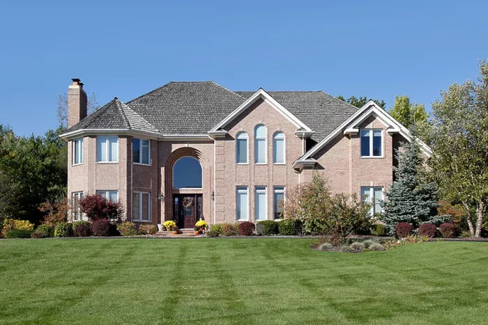 Framed Print : Large brick home in suburbs with arched entry Framed Print : Large brick home in suburbs with arched entry
