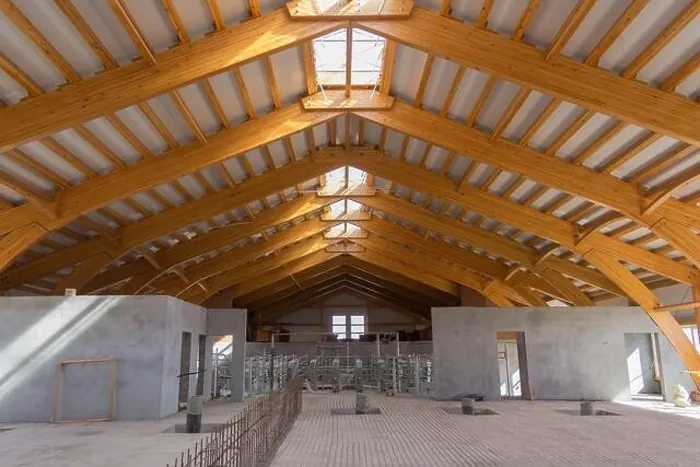 Framed Print : Large hangar. Glued laminated timber construction. Roof construction of laminated veneer lumber. Building. Glued laminated timber. Building. Construct