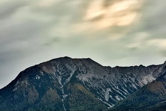 Framed Print : a large mountain landscape with cloudy sky Framed Print : a large mountain landscape with cloudy sky