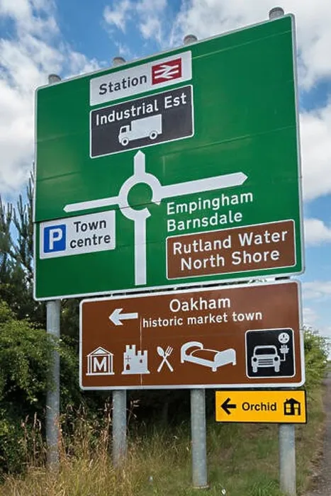 Framed Print : Large new green roundabout road primary route direction sign and brown tourist information sign, Oakham, Rutland, England, UK Framed Print : Large new green roundabout road primary route direction sign and brown tourist information sign, Oakham, Rutland, England, UK
