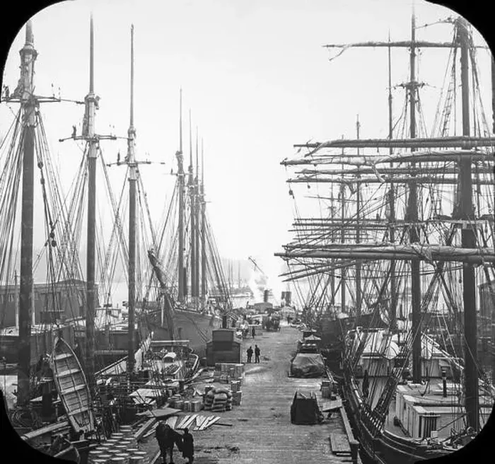 Framed Print : Late Victorian view of the docks in New York City. many sailing ships can be seen loading or unloading their goods Framed Print : Late Victorian view of the docks in New York City. many sailing ships can be seen loading or unloading their goods
