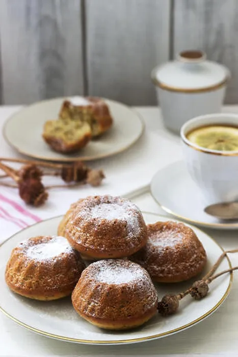 Framed Print : Lemon poppy biscuit muffins for tea on a light background. Selective focus Framed Print : Lemon poppy biscuit muffins for tea on a light background. Selective focus