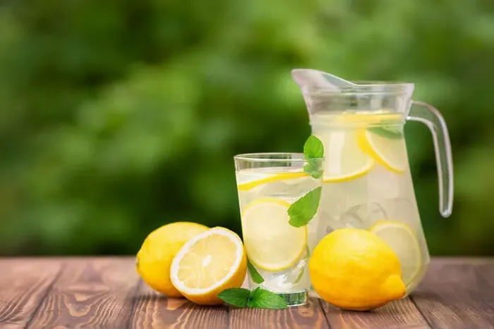 Framed Print : lemonade in glass and jug on wooden table outdoors. Summer refreshing drink. Cold detox water with lemon Framed Print : lemonade in glass and jug on wooden table outdoors. Summer refreshing drink. Cold detox water with lemon