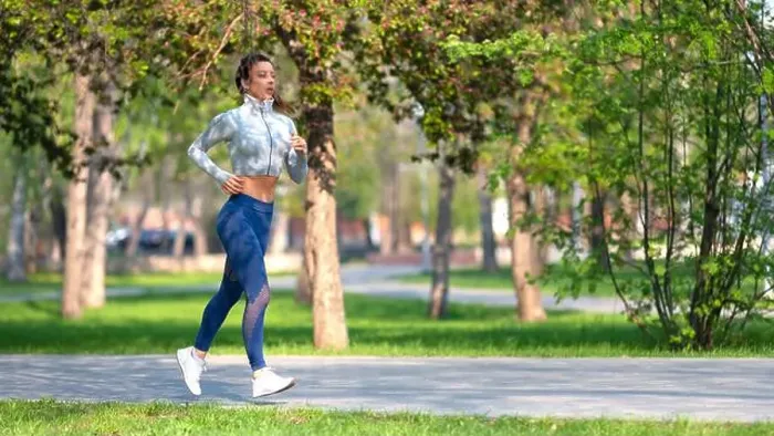 Framed Print : Full length photo of a woman running in park in early morning Framed Print : Full length photo of a woman running in park in early morning