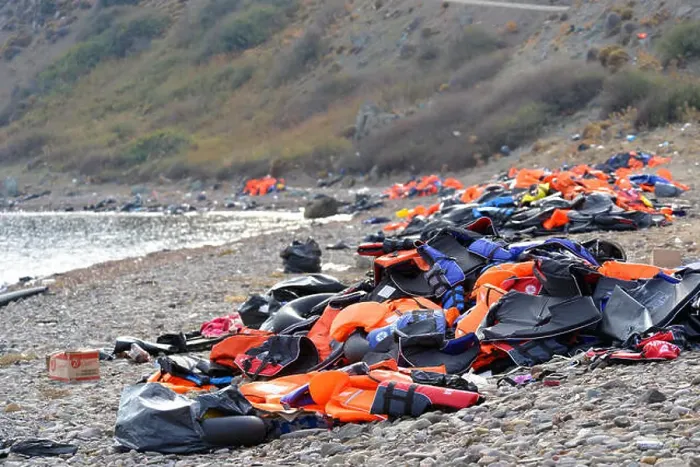 Framed Print : Lifejackets, rubber rings an pieces of the rubber dinghys discarded on a beach near Molyvos Framed Print : Lifejackets, rubber rings an pieces of the rubber dinghys discarded on a beach near Molyvos