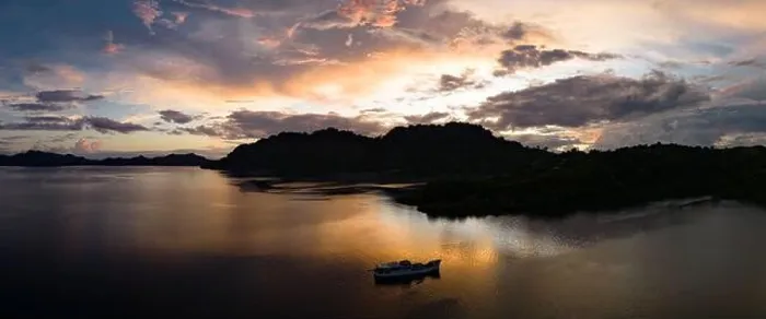 Framed Print : The last light of day illuminates clouds drifting above remote islands in the Solomon Islands. This country is home to high marine biodiversity Framed Print : The last light of day illuminates clouds drifting above remote islands in the Solomon Islands. This country is home to high marine biodiversity