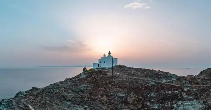 Framed Print : Lighthouse and Agios Nikolaos church on a rocky cape Framed Print : Lighthouse and Agios Nikolaos church on a rocky cape