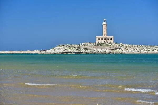 Lighthouse from the coast of Vieste on a sunny day, Puglia region, Italy