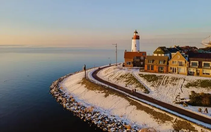 Framed Print : Lighthouse of Urk with snow landscape during winter in the Netherlands Framed Print : Lighthouse of Urk with snow landscape during winter in the Netherlands