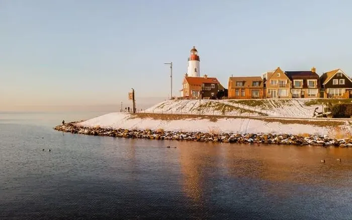 Framed Print : Lighthouse of Urk with snow landscape during winter in the Netherlands Framed Print : Lighthouse of Urk with snow landscape during winter in the Netherlands