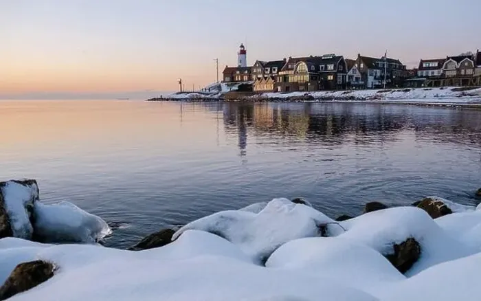 Framed Print : Lighthouse of Urk during winter with snow landscape in the Netherlands Framed Print : Lighthouse of Urk during winter with snow landscape in the Netherlands