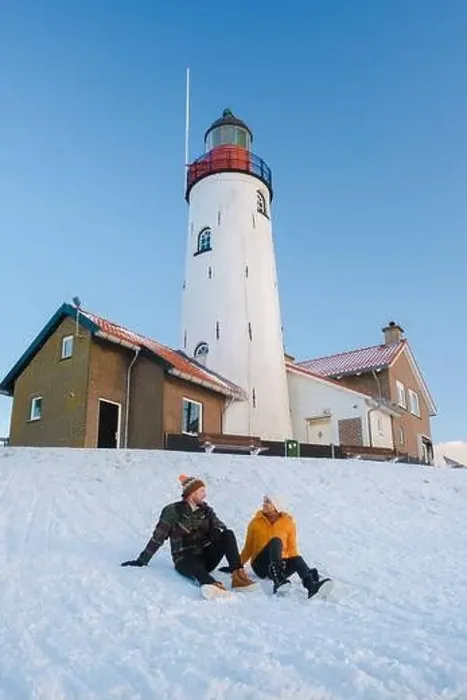 Framed Print : Lighthouse of Urk during winter with snow landscape in the Netherlands Framed Print : Lighthouse of Urk during winter with snow landscape in the Netherlands
