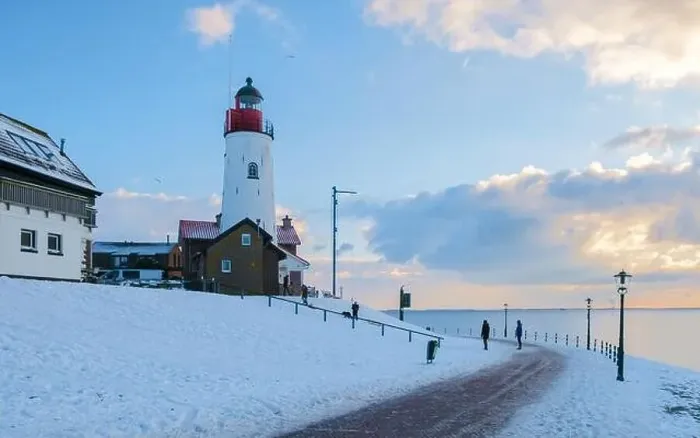 Framed Print : Lighthouse of Urk during winter with snow landscape in the Netherlands on a sunny day Framed Print : Lighthouse of Urk during winter with snow landscape in the Netherlands on a sunny day