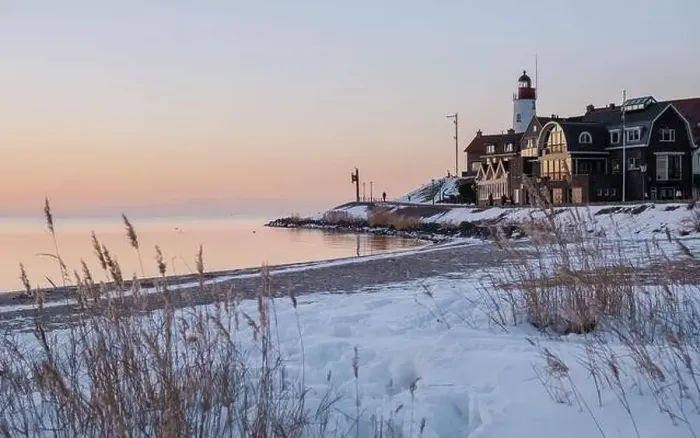 Framed Print : Lighthouse of Urk during winter with snow landscape in the Netherlands at sunset Framed Print : Lighthouse of Urk during winter with snow landscape in the Netherlands at sunset