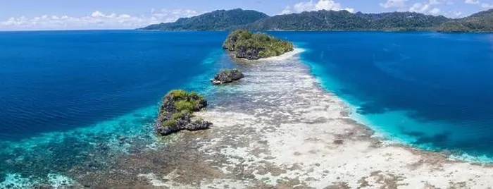 Framed Print : Limestone islands are surrounded by healthy coral reefs in Raja Ampat, Indonesia. This region is thought to be the epicenter of marine bodiversity Framed Print : Limestone islands are surrounded by healthy coral reefs in Raja Ampat, Indonesia. This region is thought to be the epicenter of marine bodiversity