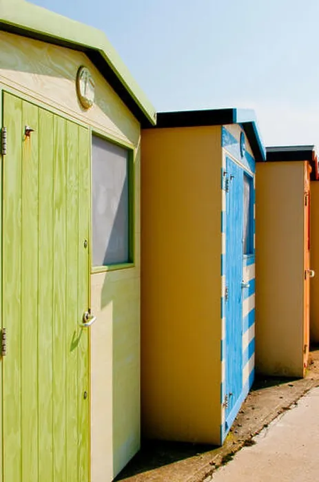 Framed Print : A line of beach huts on the seashore at Seaford, East Sussex Framed Print : A line of beach huts on the seashore at Seaford, East Sussex