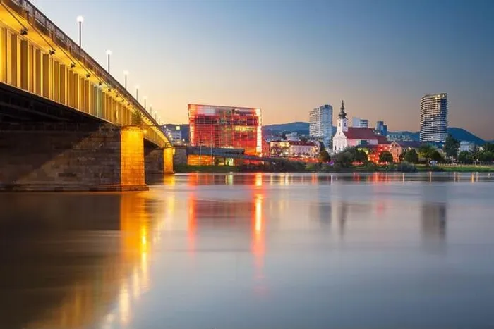 Framed Print : Linz, Austria. Cityscape image of riverside Linz, Austria at summer sunset with reflection of the city lights in Danube river Framed Print : Linz, Austria. Cityscape image of riverside Linz, Austria at summer sunset with reflection of the city lights in Danube river