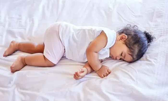 Framed Print : Little baby girl sleeping on her bed Framed Print : Little baby girl sleeping on her bed