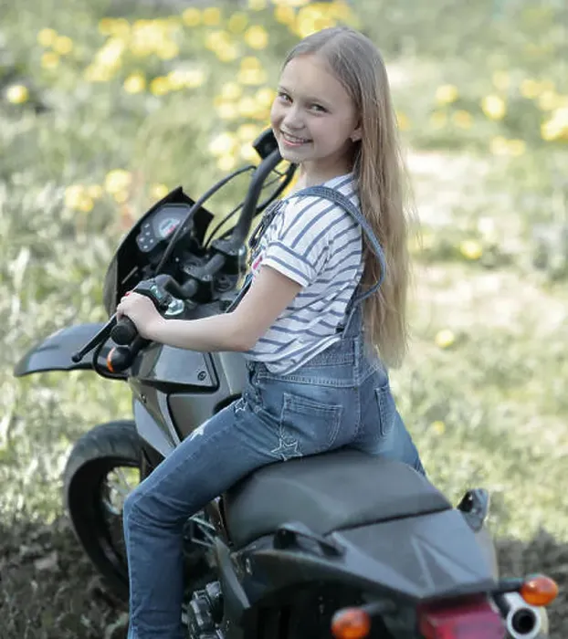 Framed Print : little biker girl riding her motorcycle Framed Print : little biker girl riding her motorcycle