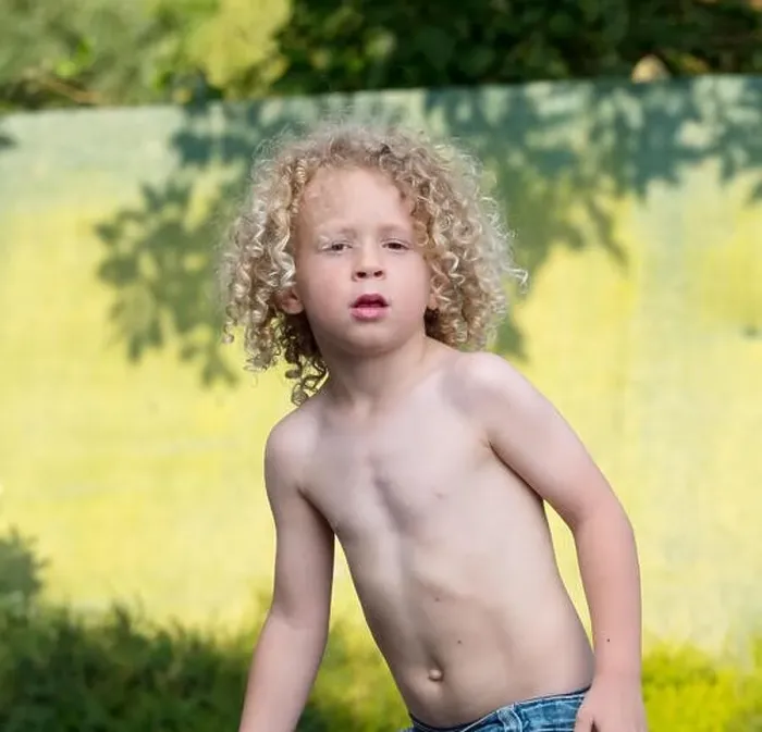 Framed Print : little boy shirtless playing in the garden Framed Print : little boy shirtless playing in the garden