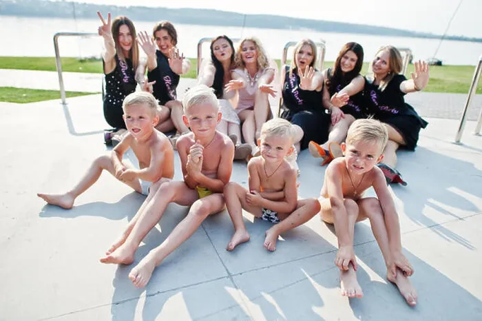 Framed Print : Four little boys in briefs with group of girls at hen party Framed Print : Four little boys in briefs with group of girls at hen party