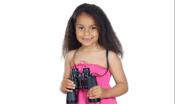 Framed Print : Little girl with binoculars on a over white background Framed Print : Little girl with binoculars on a over white background