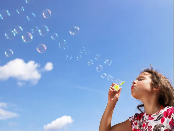 Framed Print : Little girl blowing bubbles Framed Print : Little girl blowing bubbles