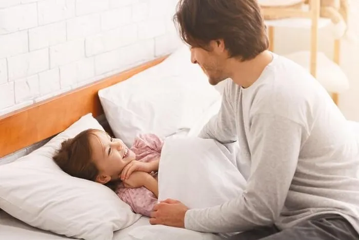 Framed Print : Little girl happy to see her dad in the morning Framed Print : Little girl happy to see her dad in the morning