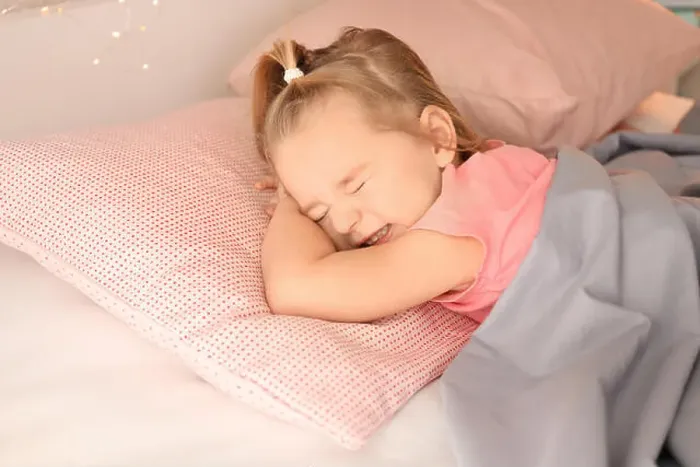 Framed Print : Little girl having bad dream while sleeping in bed at home Framed Print : Little girl having bad dream while sleeping in bed at home