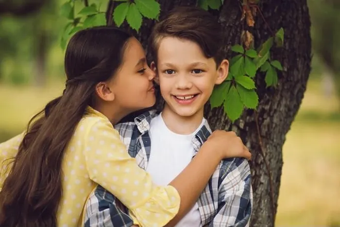 Framed Print : Little girl kissing boy Framed Print : Little girl kissing boy