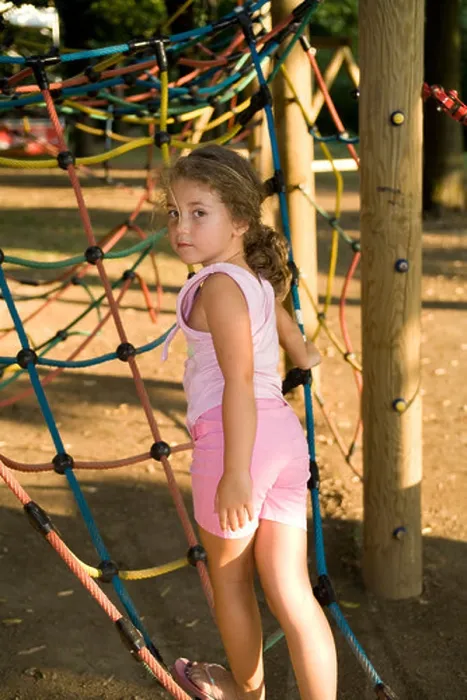 Framed Print : Little girl at the playground looking backwards Framed Print : Little girl at the playground looking backwards