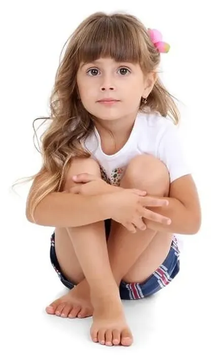 Framed Print : Little girl sitting on floor isolated on white Framed Print : Little girl sitting on floor isolated on white
