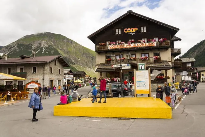 Framed Print : LIVIGNO, ITALY - AUGUST 1: Tourists walk on streets of duty-free area on 1 August 2016 in Livigno, Italy Framed Print : LIVIGNO, ITALY - AUGUST 1: Tourists walk on streets of duty-free area on 1 August 2016 in Livigno, Italy