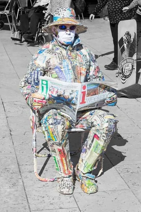 Framed Print : Living statue man covered in strips of newspaper sat reading paper in Bournemouth Square, Bournemouth, Dorset UK in September Framed Print : Living statue man covered in strips of newspaper sat reading paper in Bournemouth Square, Bournemouth, Dorset UK in September