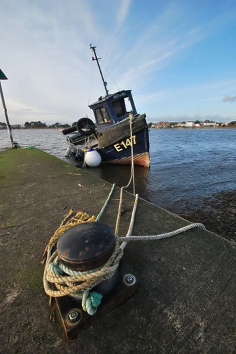 Framed Print : A local fishing vessel is seen at Mudeford Quay in Dorset, England Framed Print : A local fishing vessel is seen at Mudeford Quay in Dorset, England