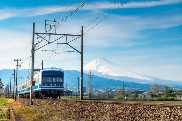 Framed Print : A local train of JR Izuhakone Tetsudo-Sunzu Line traveling through the countryside on a sunny winter day and Mt. Fuji in Mishima, Shizuoka, Japan Framed Print : A local train of JR Izuhakone Tetsudo-Sunzu Line traveling through the countryside on a sunny winter day and Mt. Fuji in Mishima, Shizuoka, Japan